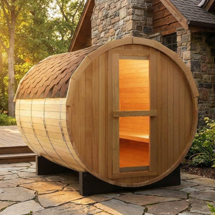 Wooden barrel sauna outdoors on a stone patio
