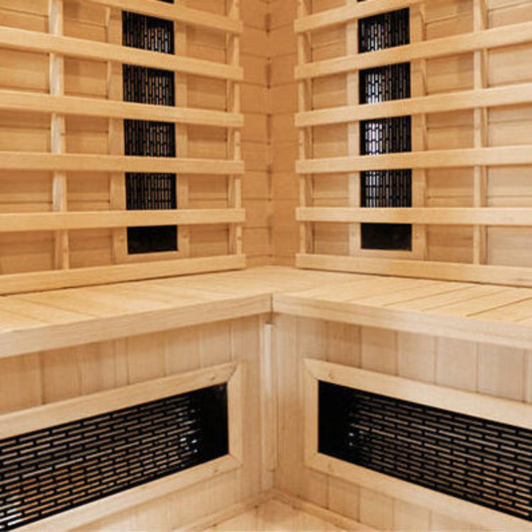 Wooden sauna interior with benches and infrared panels.