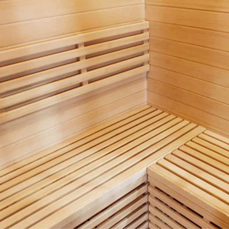 Wooden sauna interior with bench and wall panels