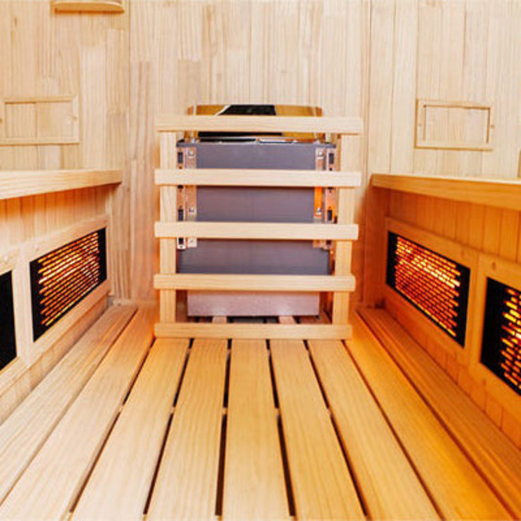 Wooden sauna with benches and heaters on a wooden floor.